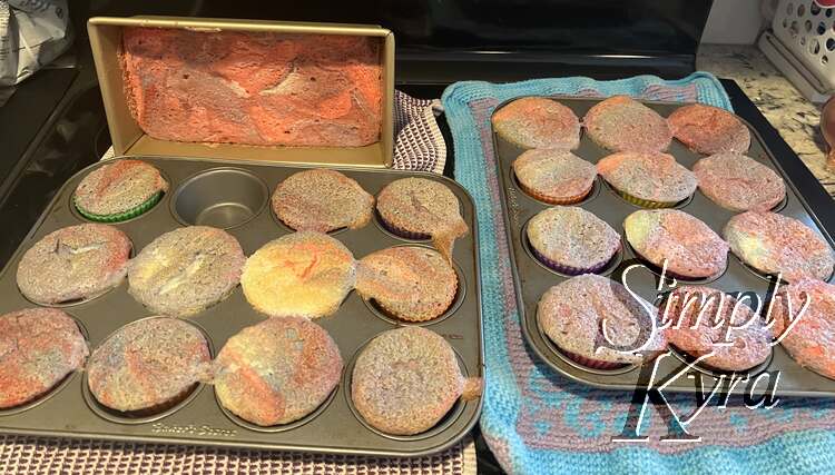 Image shows the two cupcake pans side by side with the gorgeously colored loaf pan behind it.
