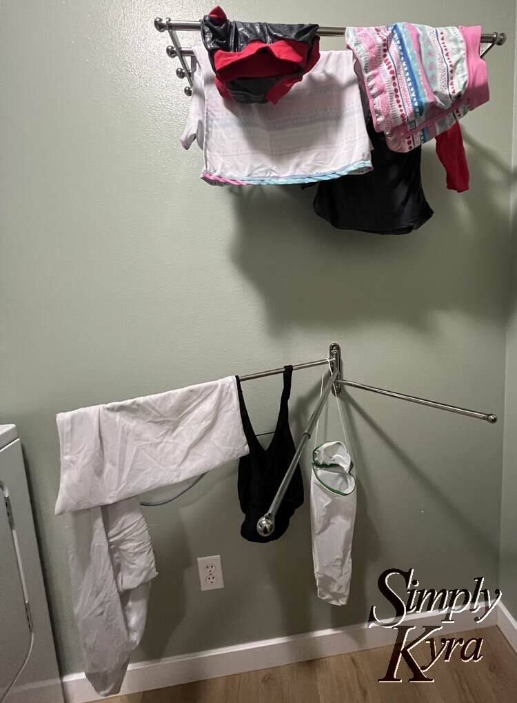 Image shows both shelf and swing out towel holder in use. 