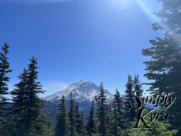 Mount Rainier/Tahoma framed with minimal trees to the bottom and right.