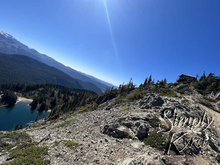 Looking back from the ridgeline at the fire lookout with lake Eunice down below. 