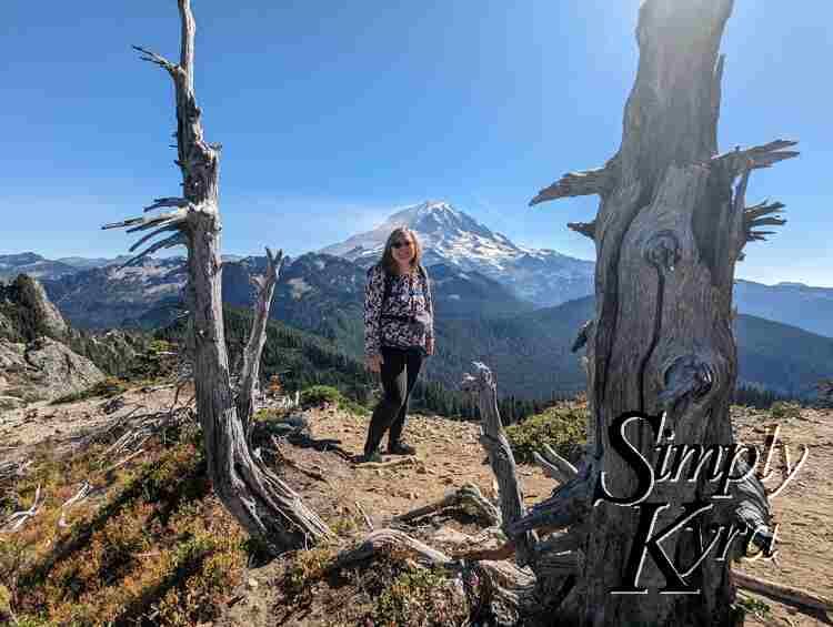 Me standing in front of Mount Rainier/Tahoma with two trees framing us.