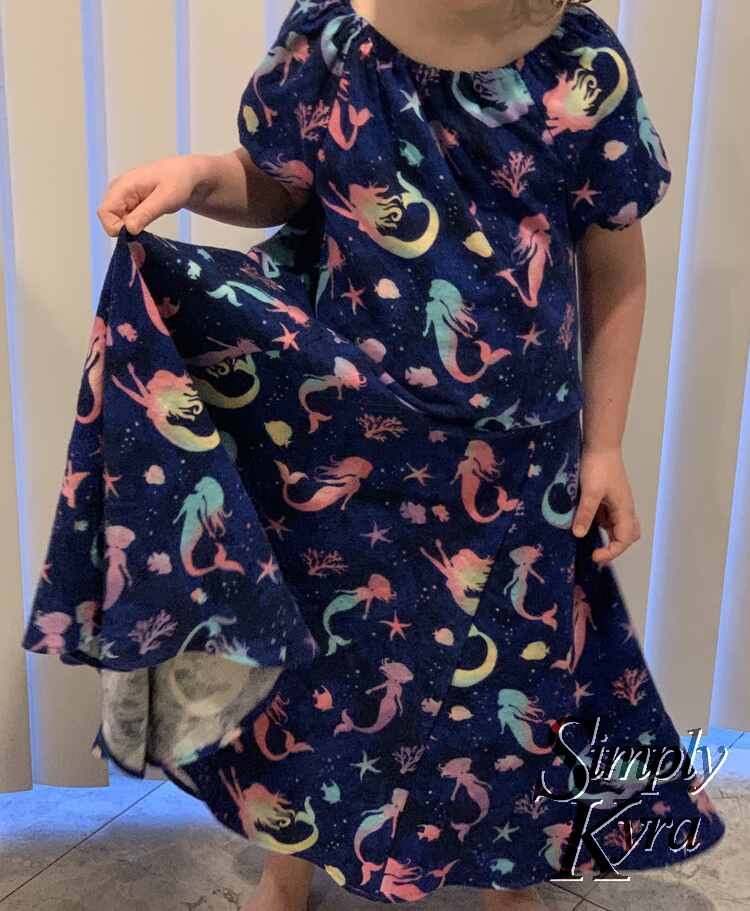 Image shows the dress in place with the side lifted up.