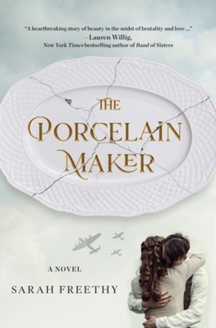 The cover features the title “The Porcelain Maker” by Sarah Freethy. The cover shows a broke porcelain platter behind the title. Below are two people hugging with airplanes above. 