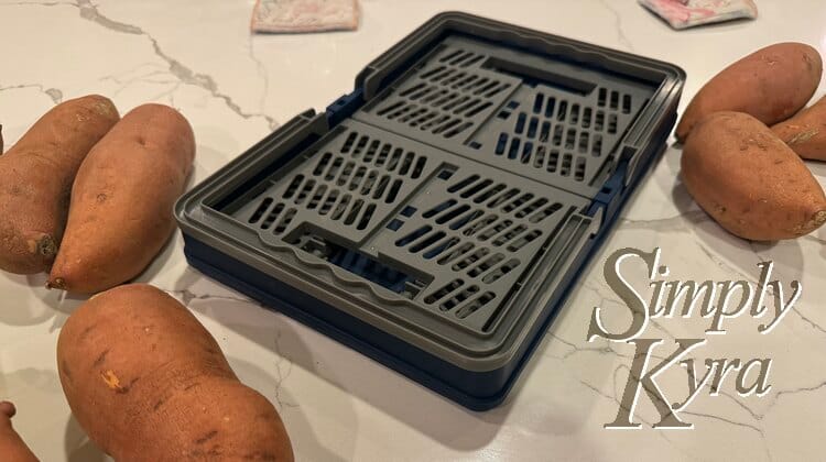 Image shows a flat basket all folded up with yams around it. 