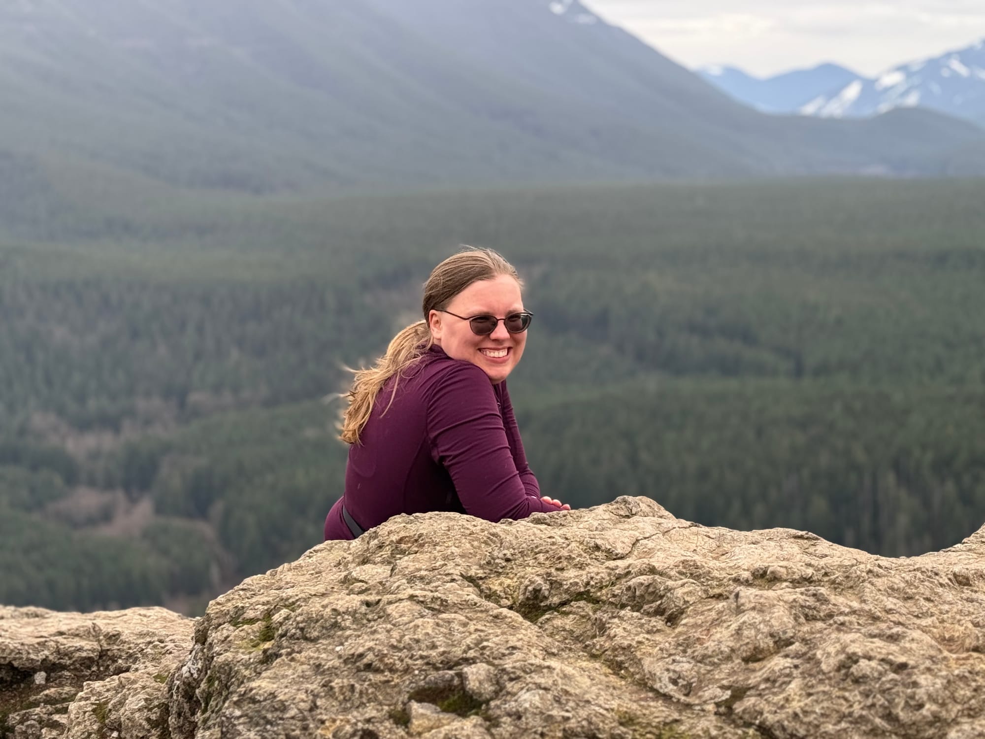 Image shows me sitting on a rock looking towards the camera.