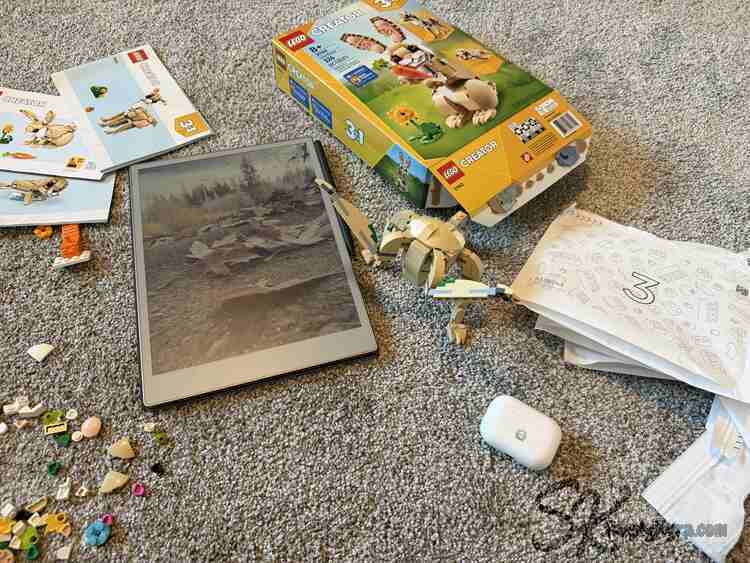 Flat lay showing the loose extra pieces, turned off reMarkable, paper off to the side, and a finished Rocky.