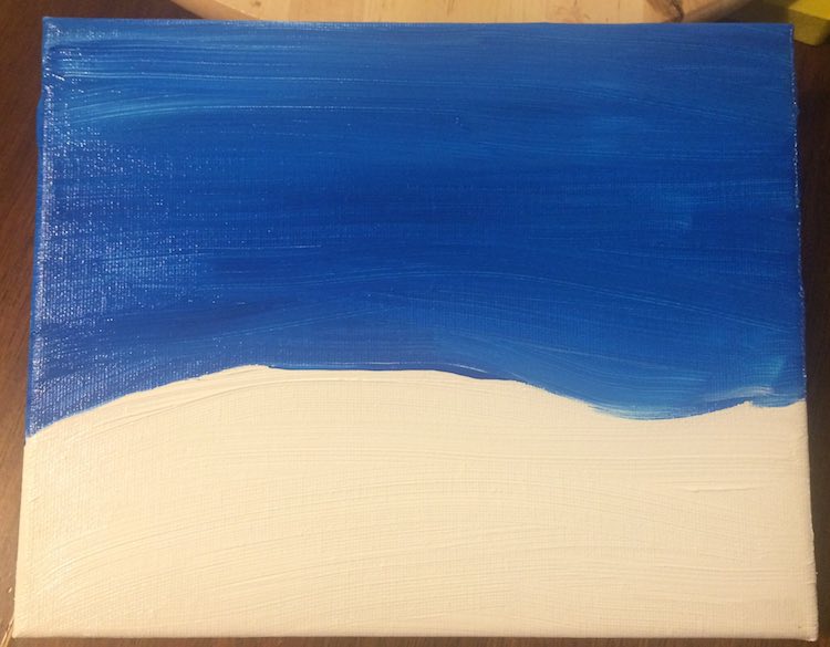 Paint the background on. I made the ground white for the snow and blue for the sky. Made it look like it was hilly by altering the height of the snow.