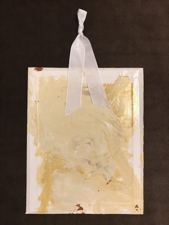 When it’s all dry you can use a glue gun to attach a ribbon to hang the canvas.