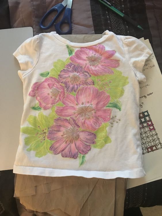 Finished t-shirt. The glitter shows through the colored petals. I had also added details to the leaves.