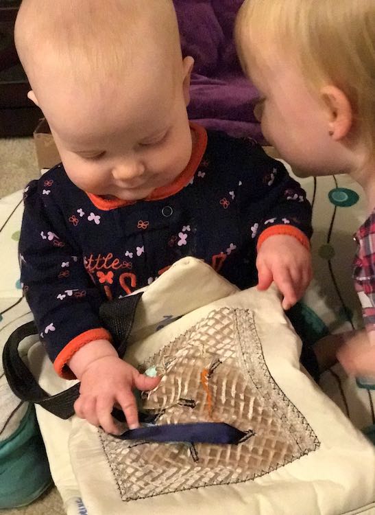 Ada checking out her sister's book.