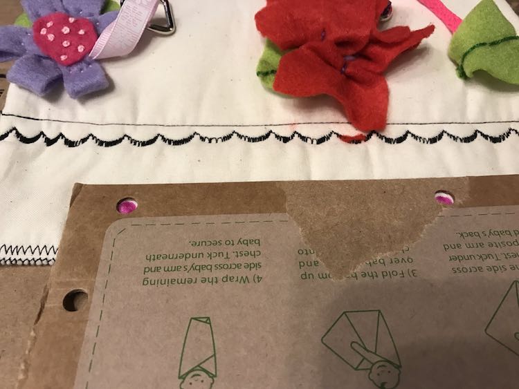 Use a template to mark your holes using a disappearing ink pen. (Yes the cardboard was from a swaddle receiving blanket.)