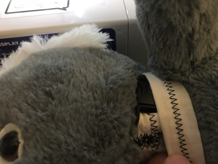 Size the collar by laying it over your stuffed animals neck and sizing it. Remember your stuffed animal will not grow and cannot choke. You need just enough space to be able to do it up and undo it.