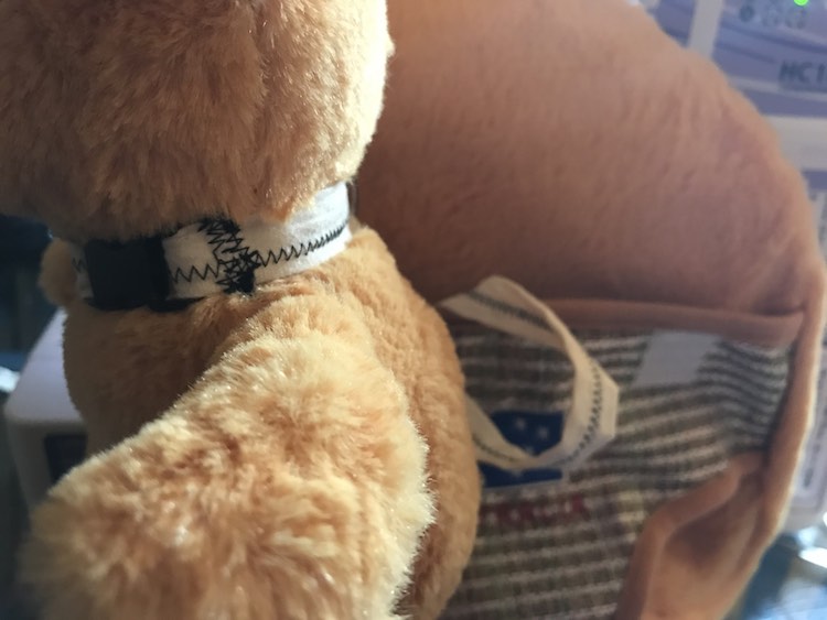 Now attach your stuffed animal to the collar.