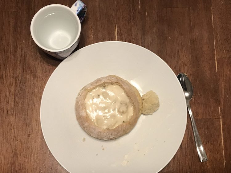 Simple bread bowl with clam chowder from above.