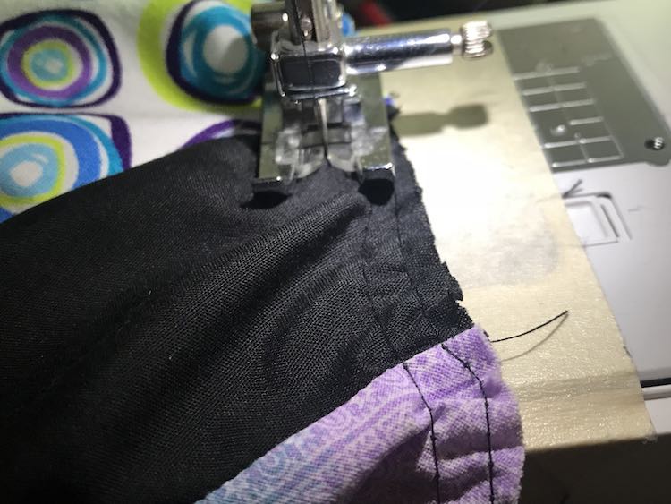 Sewing the long stitch to gather the skirt.