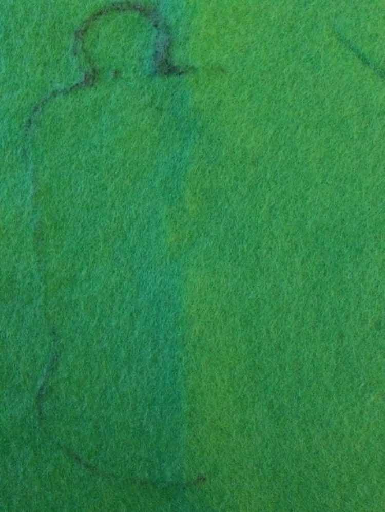 I started out by drawing directly onto the green felt the face I wanted to for crocodile. I decided to save time by making it symmetrical so I only have to draw half the outline before folding it in half and cutting it out.