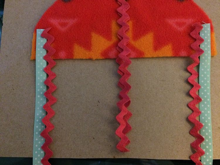 Then added my center and more edge ribbons. As these are folded over (looped) I made it shorter than the page.