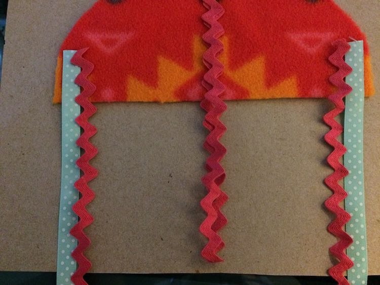Then added my center and more edge ribbons. As these are folded over (looped) I made it shorter than the page.