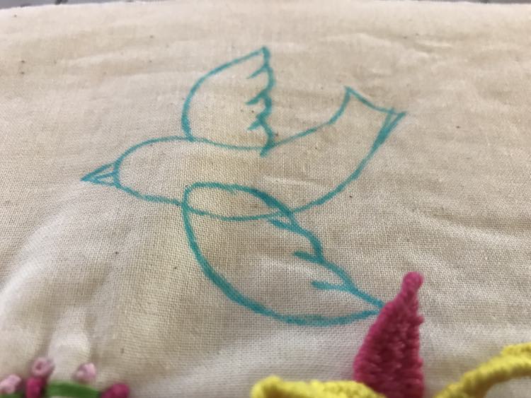 I decided to add a bird to fill the empty space at the top and drew out a simplified bird with a disappearing ink pen.
