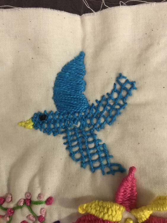 I then filled in the three main spaces with three different textures while keeping them all blue to unify the bird as a whole. I then added a beak and a black eye.