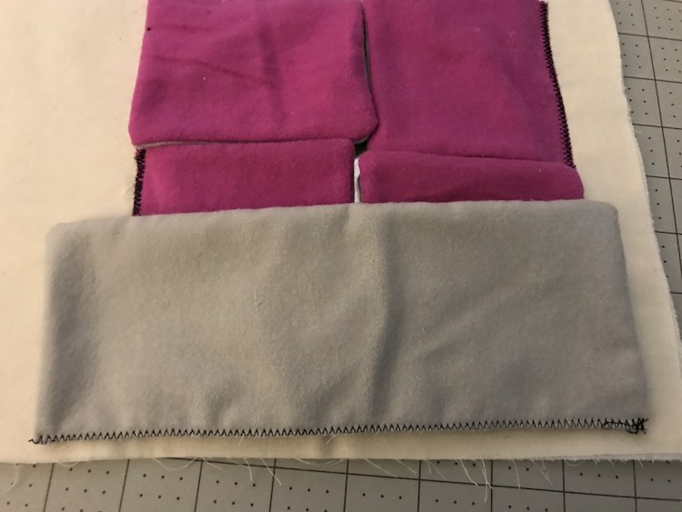 I had cut and sewn grey flaps to go over the pink ones but they ended up being too skinny. 