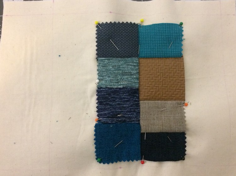 Grid of fabric samples pinned to the page.
