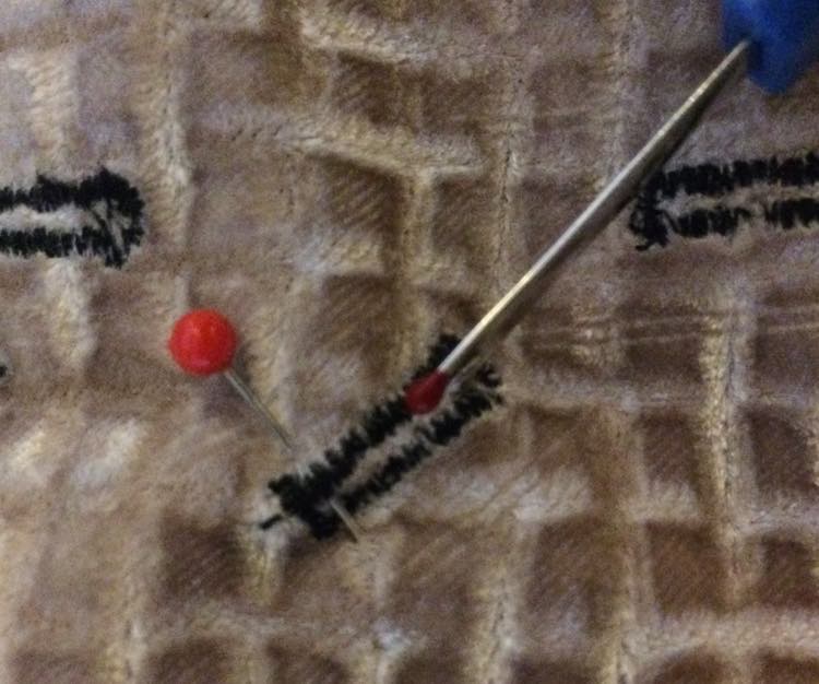 Then cut the buttonhole with a seam ripper.
