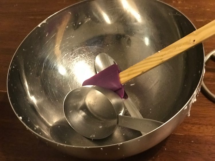 Cleanish bowl, spatula, and measuring cups after making slime.