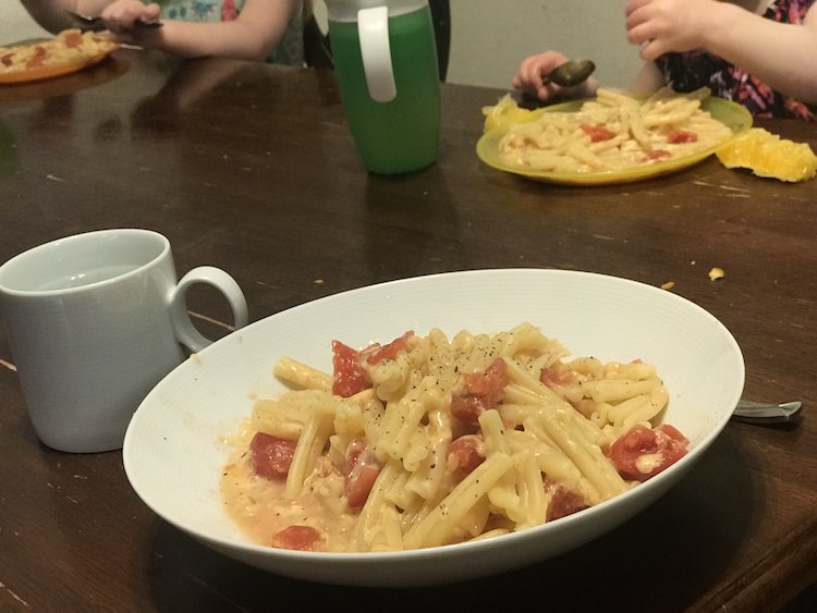 Hot pasta, tomato, and cheese is a favorite for lunch.