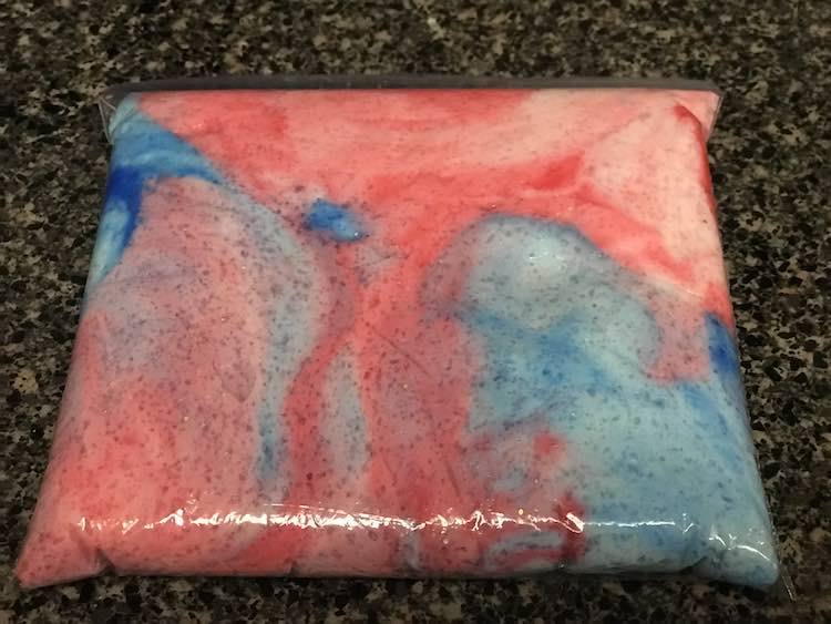 The colored slime wouldn't combine... until after it was sitting in a ziplock bag for a bit. So pretty.