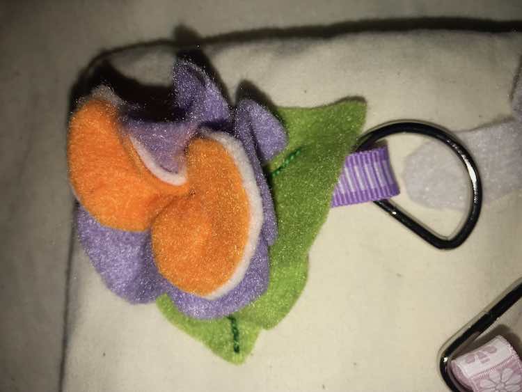 The orange felt was already attached to the white interfacing. The purple and the orange (with interfacing) petals were each cut in one piece, stacked, and then pulled tight so it folded inward.