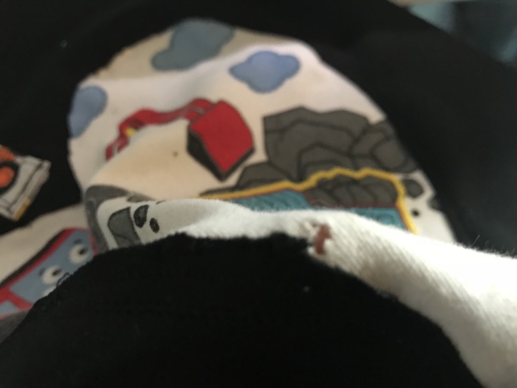 Unfortunately with the black fabric gone I realized the hole in my onesie from my sewing machine.