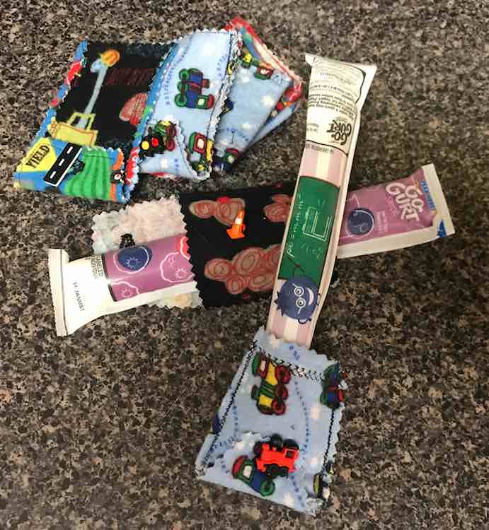 You can use the freezie holders to hold frozen yogurt tubes.