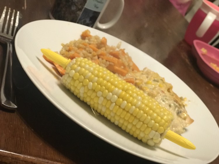 I threw some leftover rice and carrots together to reheat, topped it with the chicken, and served some corn on the cob for an easy meal.