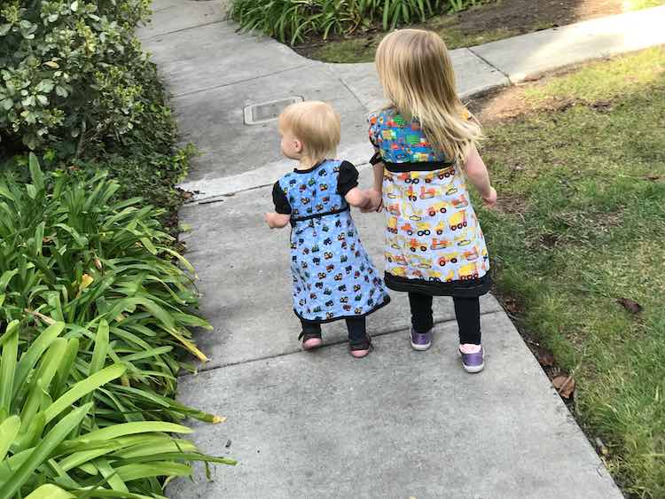 Holding hands while going for their walk.