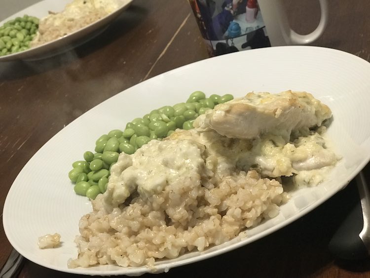 Baked chicken over rice with a side of easy Costco edamame beans... so simple.