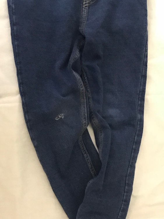 Ada's skinny and comfortable jeans that have developed a hole in the knee. They contain 5% spandex so they have a bit of a stretch.