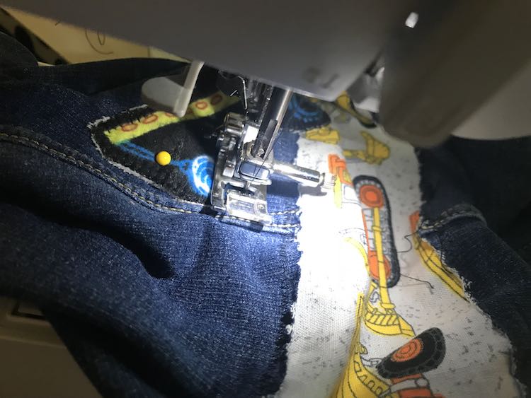 I used a blanket stitch to attach the patches onto the jeans. 