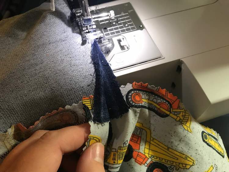 While sewing above the extension I made sure to line up the top seam so the trucks would line up, while sewing over the woven I made sure the bottom edge was lined up. 