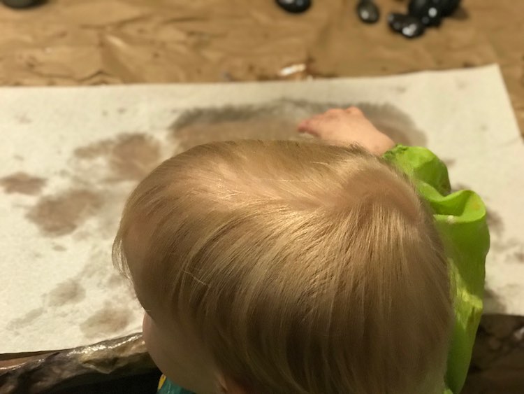 Zoey spilled her water for the paintbrushes so I laid out paper towel and she had fun pressing her hand on it as it became wet.