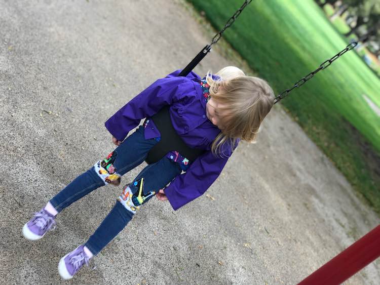 Checking out her pants while swinging.