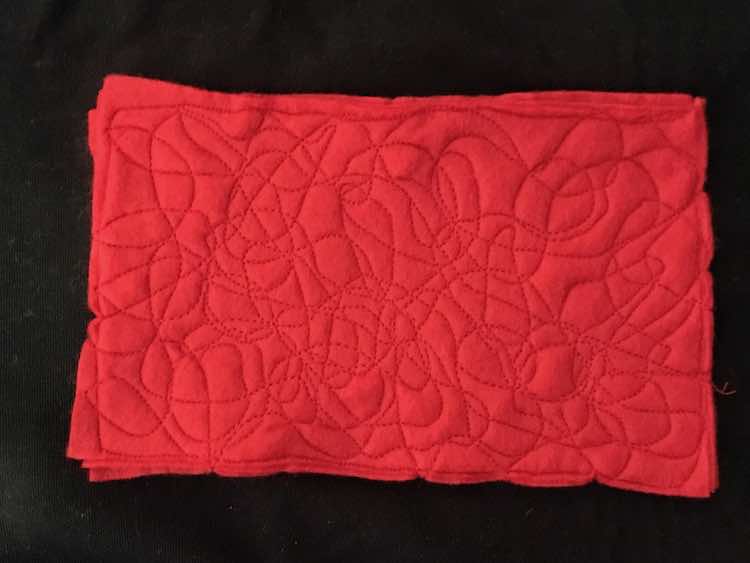 Red felt sewn together.