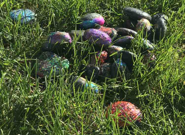 The rocks are pretty nestled in the grass.