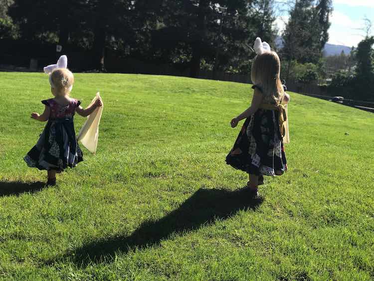 Holding their bags, wearing bunny ears, and preparing to think like bunnies.