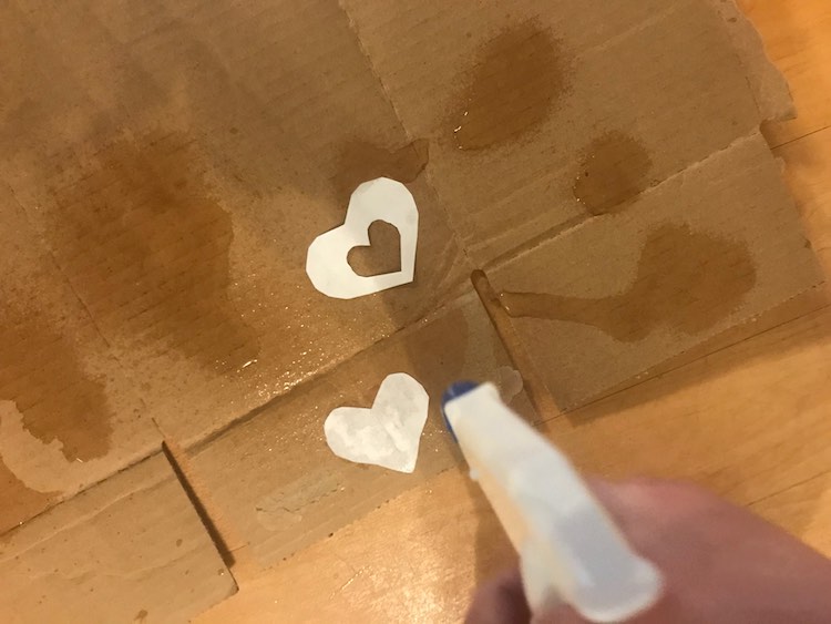 Spray the paper and cardboard with water.