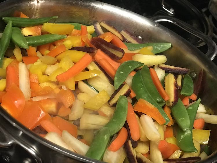 Once the ground sausage is cooked toss your vegetables in.