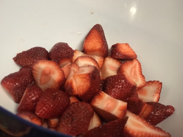 Cut up some strawberries.