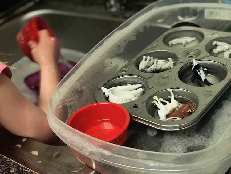 Extended the distraction (cough play) by letting Ada wash the toys in the sink.