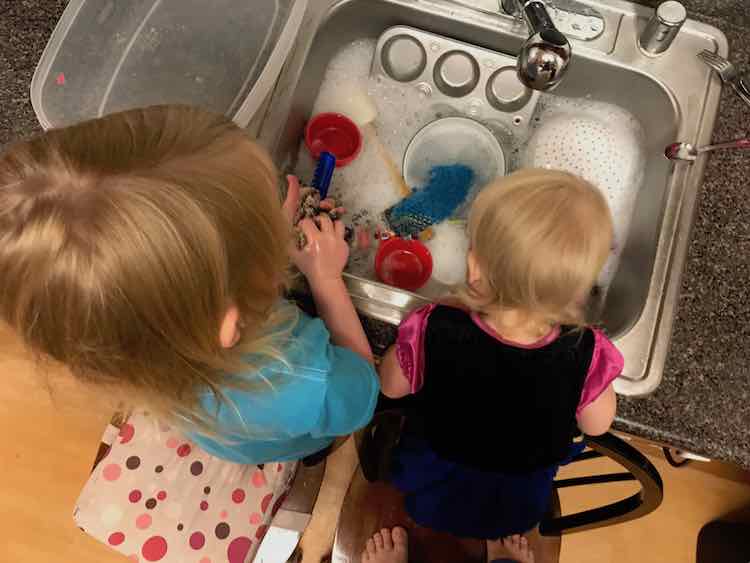 Extend the play by adding toys and then having them clean them in the sink.