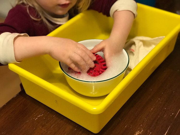 If you want it simpler you could contain it to a single sensory bin and, optionally, keep the soap in a bowl inside it.